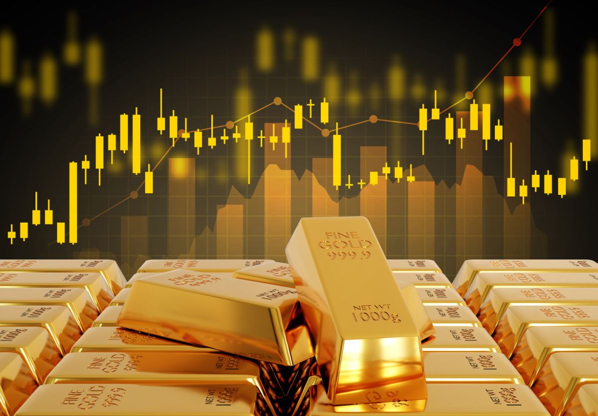 Photo of gold an its financial chart running