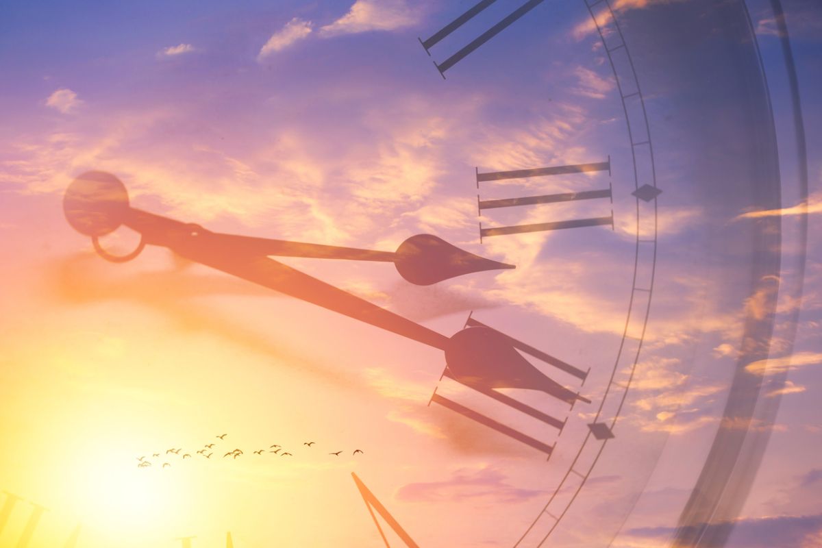 Image of the fourth turning represented by clock hands and birds in the sunset