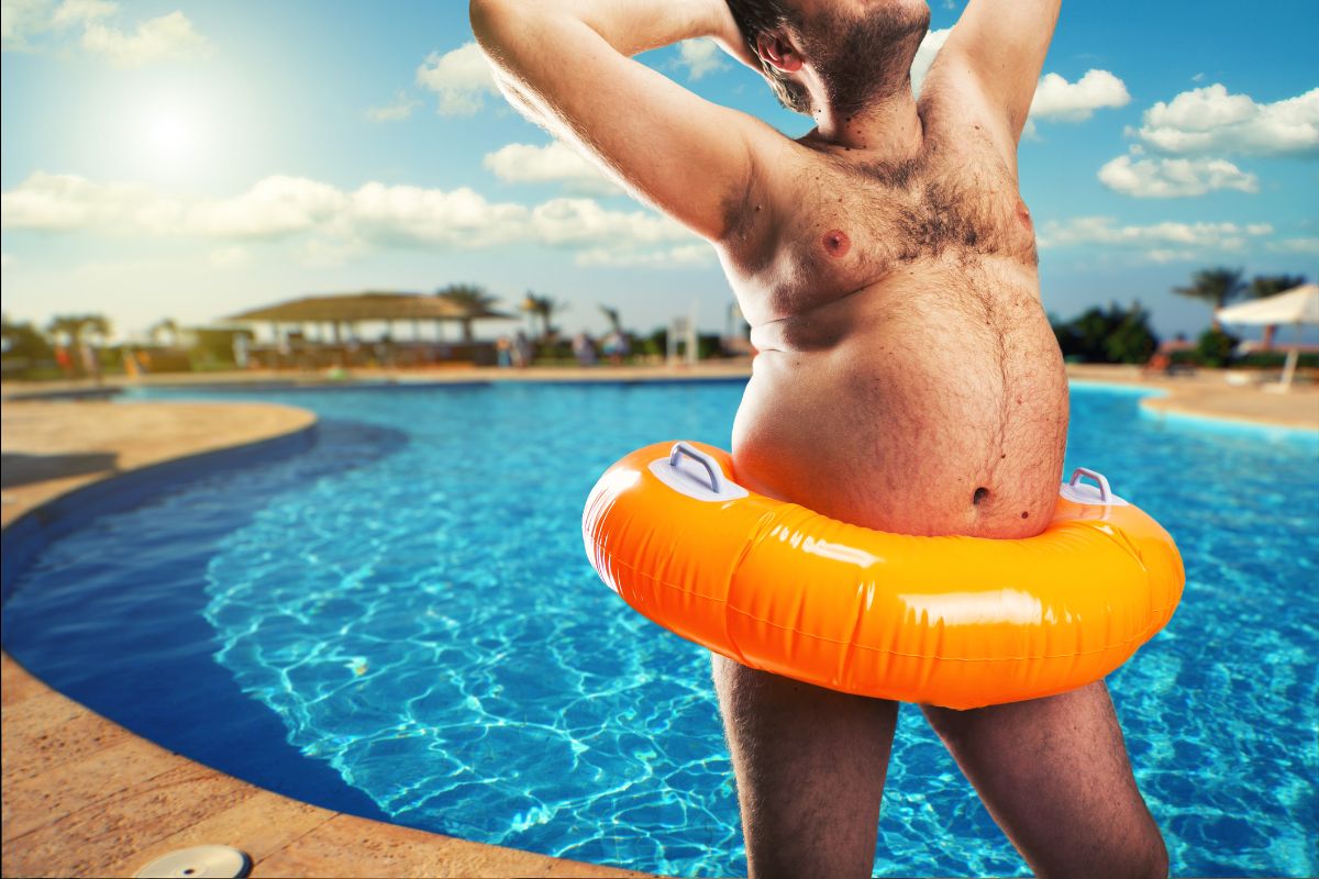 Man relaxing in a swimming pool with an inflatable ring, representing investor complacency after gains
