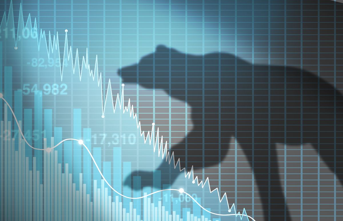 Bear silhouette over a declining stock market chart, symbolizing market downturn and rising volatility