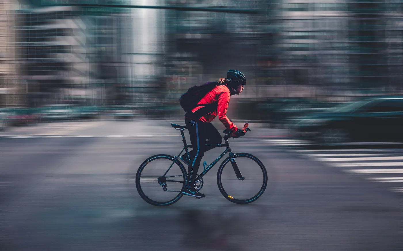 person riding nbicycle by Max Bender courtesy of Unsplash.