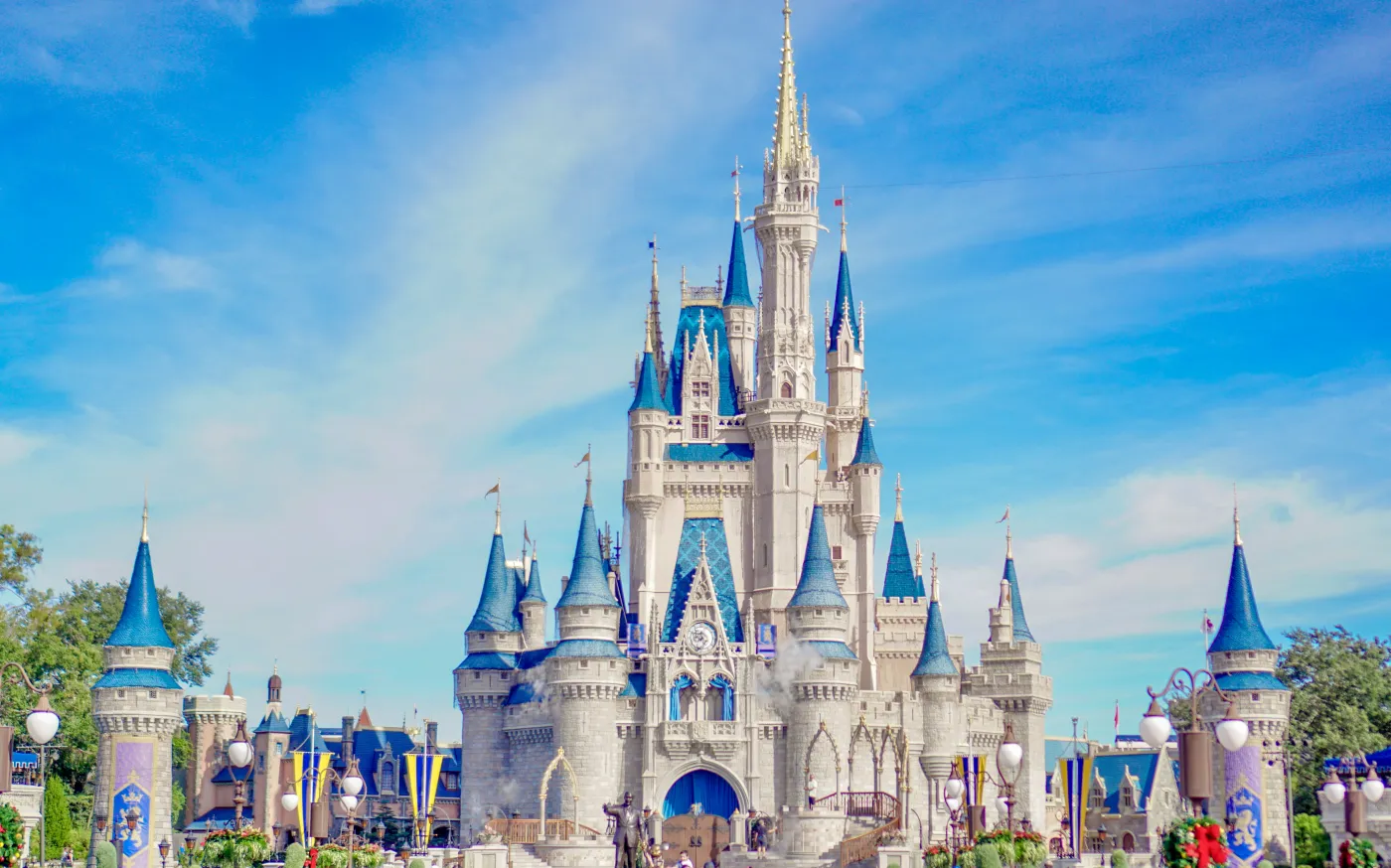 a large castle with a lot of people around it by Younho Choo courtesy of Unsplash.