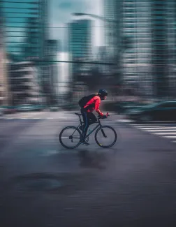 person riding nbicycle by Max Bender courtesy of Unsplash.