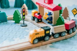 wooden train set by Jerry Wang courtesy of Unsplash.